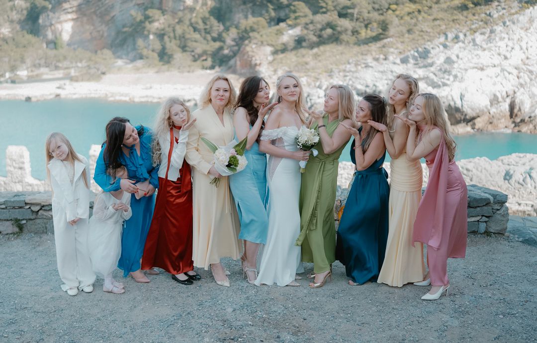 Wedding party portrait by the sea in Liguria, Italy
