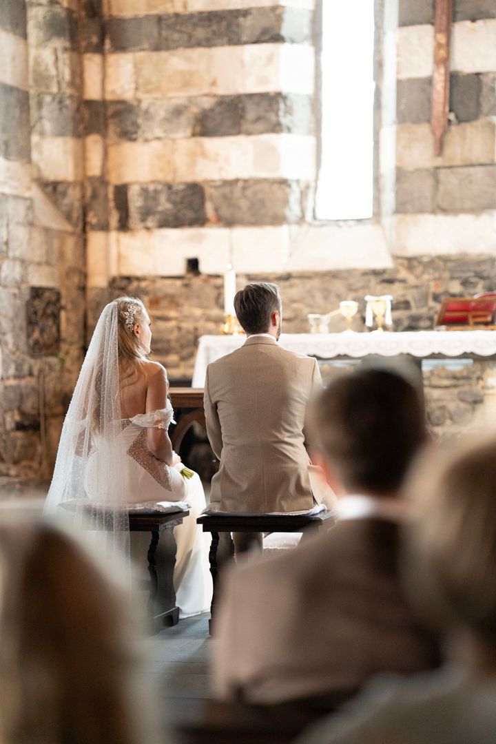 Wedding ceremony inside a historic stone church