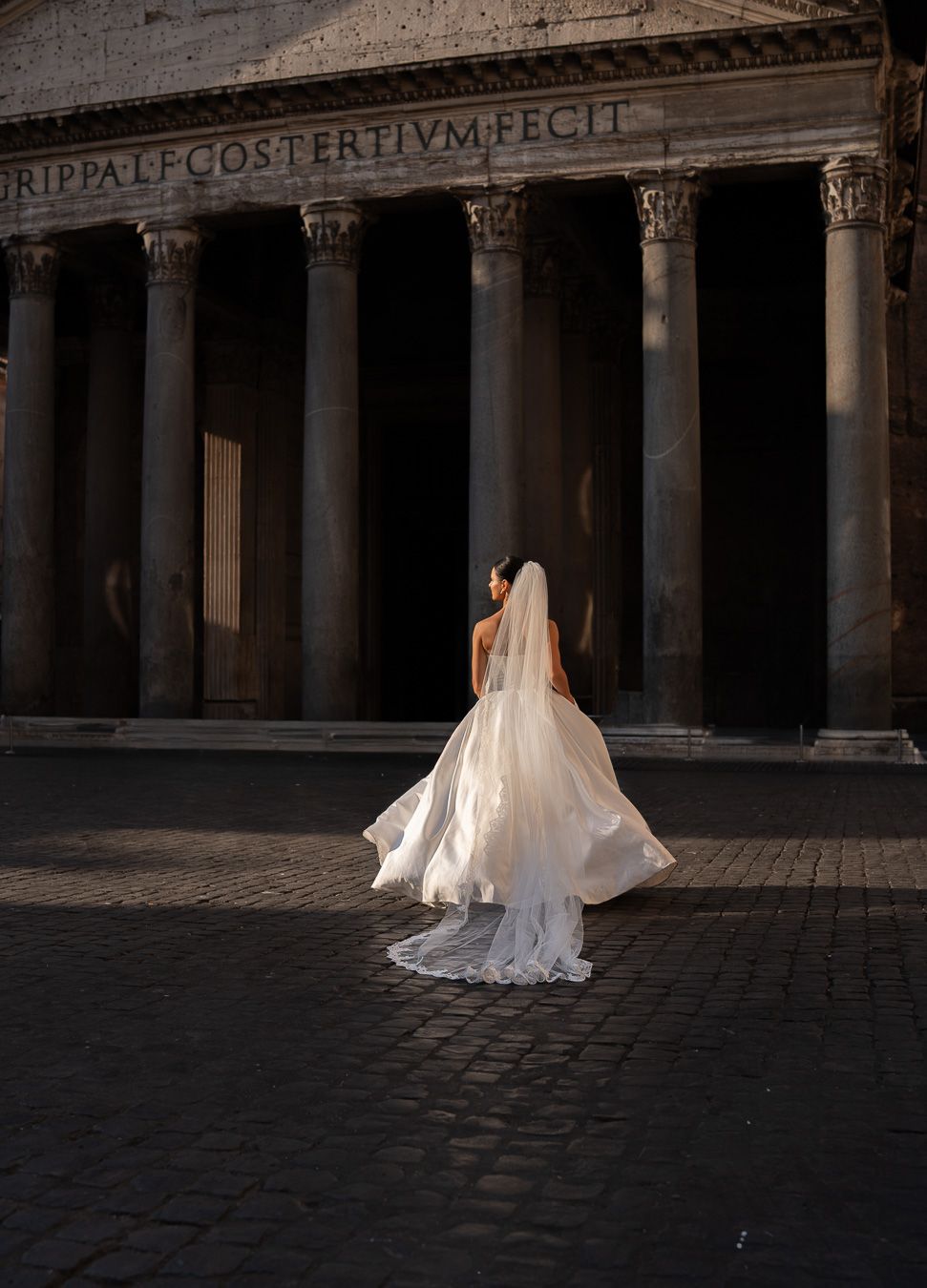 Bridal wedding portrait in front of historic architecture in Rome, Italy