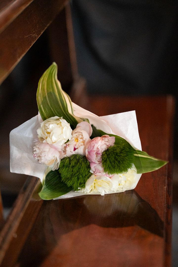 White wedding bouquet inside the church