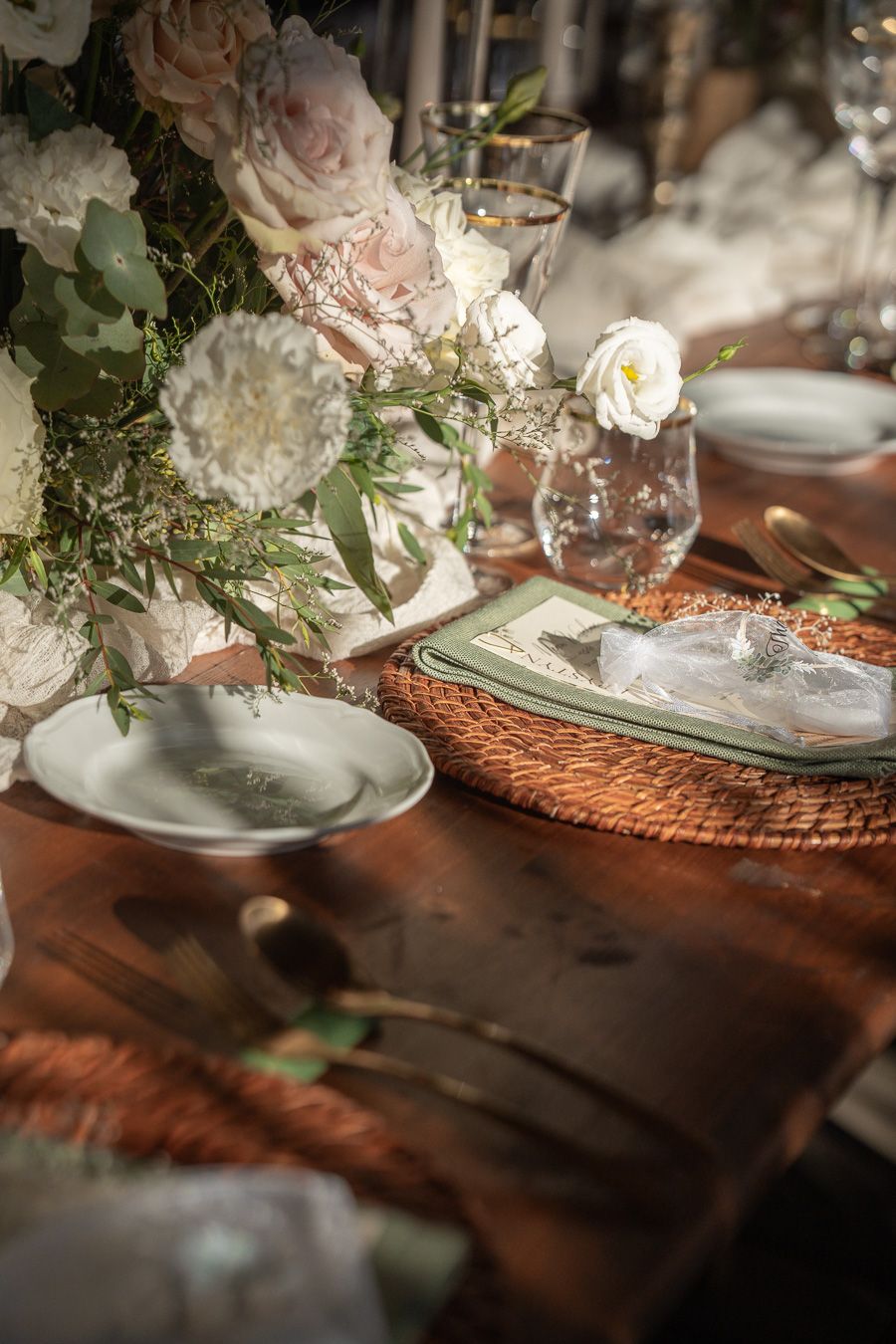 Romantic Tuscany wedding table setting with flowers and candlelight