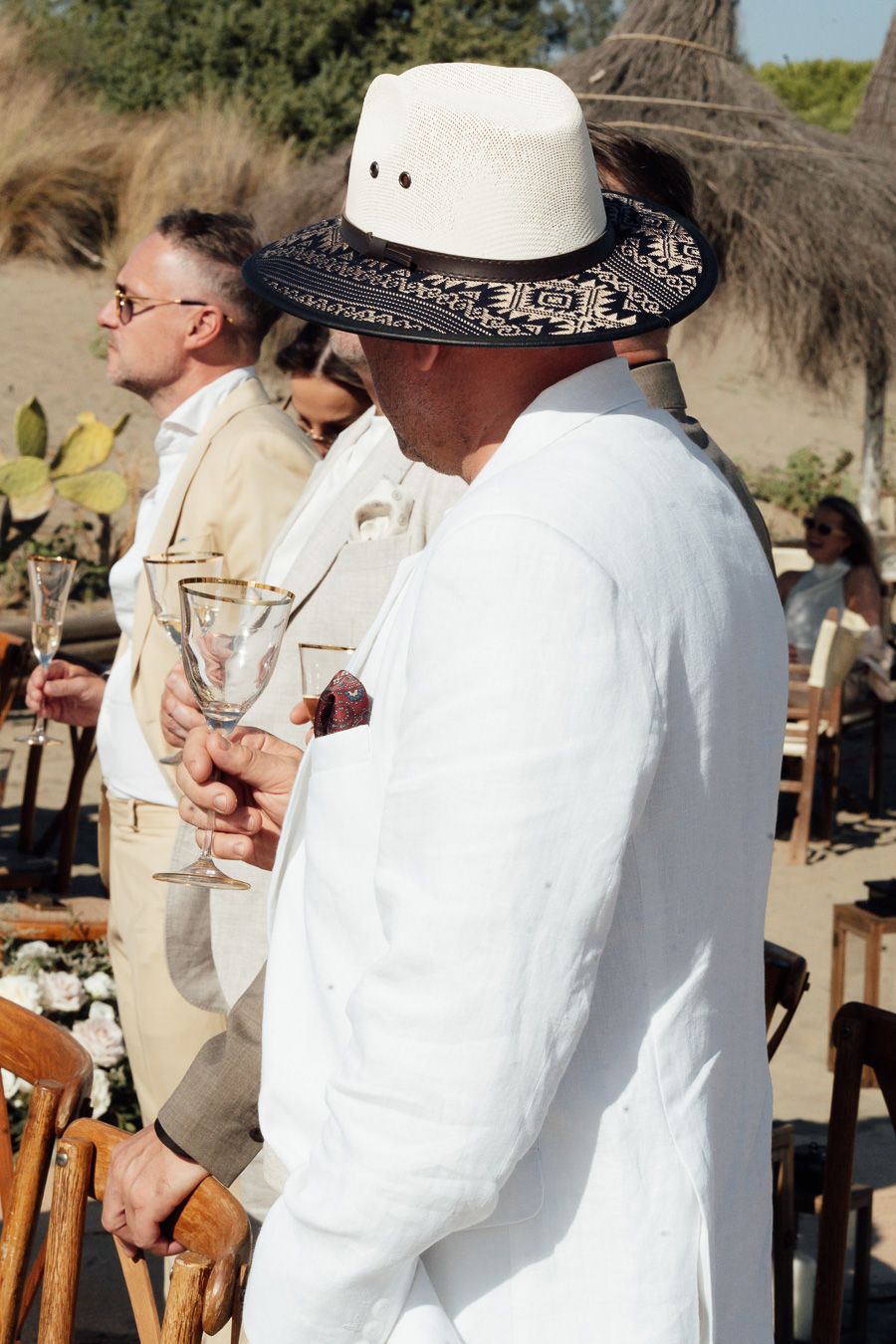 Guests at a seaside wedding in Tuscany, Italy