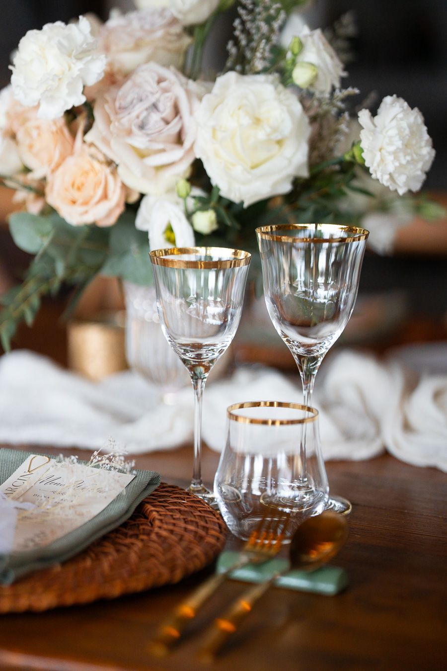 Wedding reception table with flowers and glassware in Tuscany