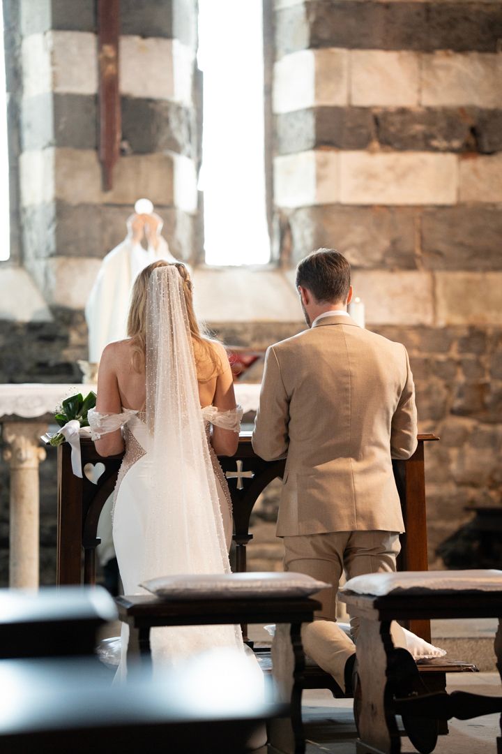 Wedding couple standing at the altar during the church ceremony