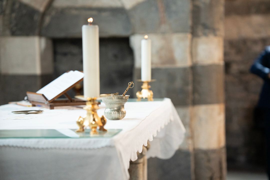 Wedding ceremony altar with candles inside a historic church