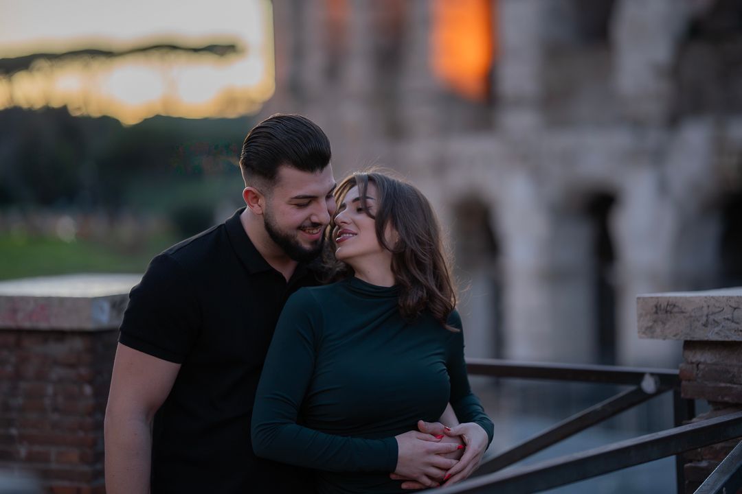 Couple photography near the Colosseum at sunset in Rome, Italy