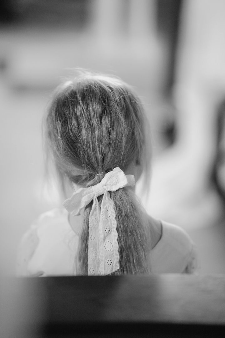 Black and white portrait of a wedding guest during the ceremony