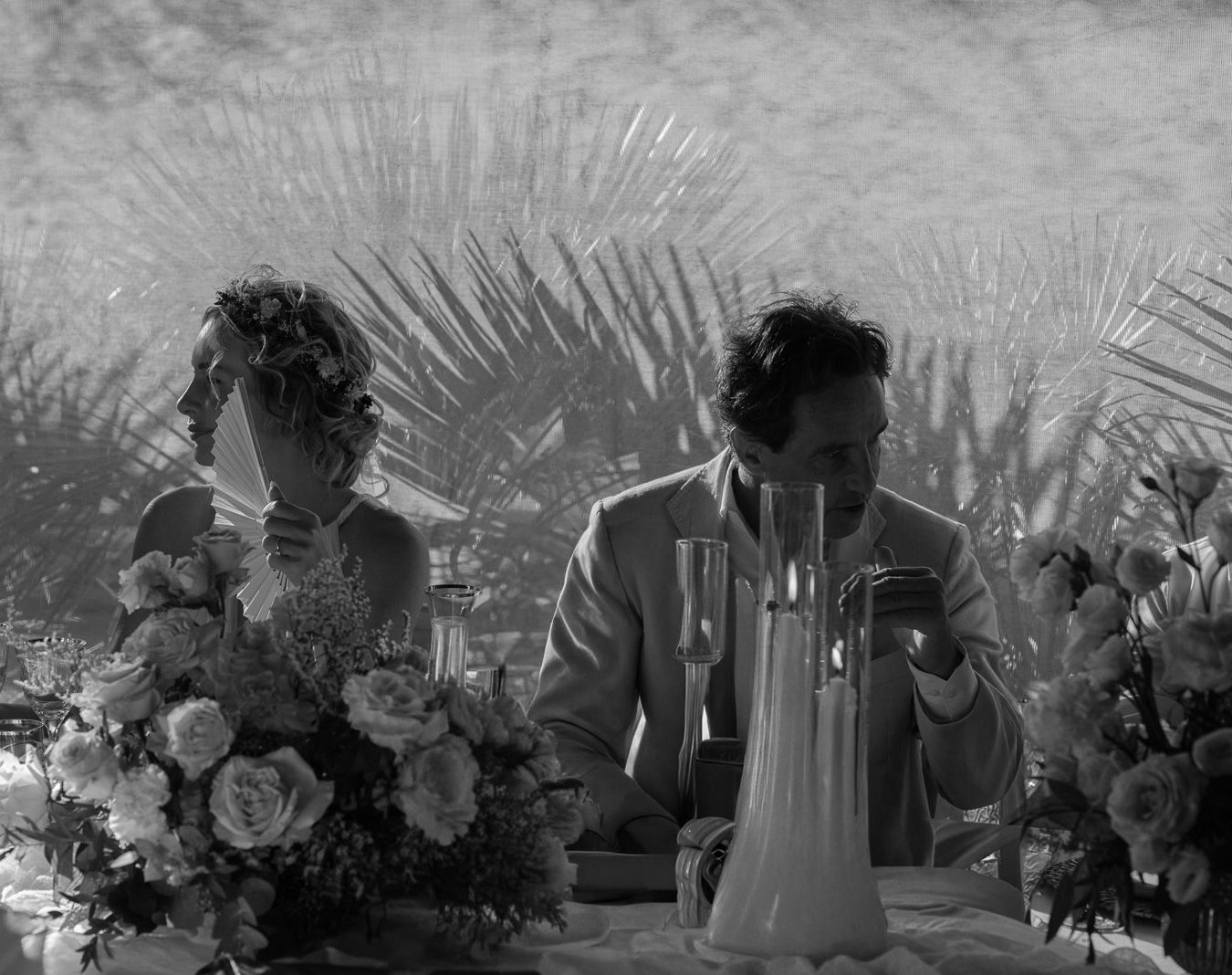 Black and white Tuscany wedding ceremony with floral arrangements