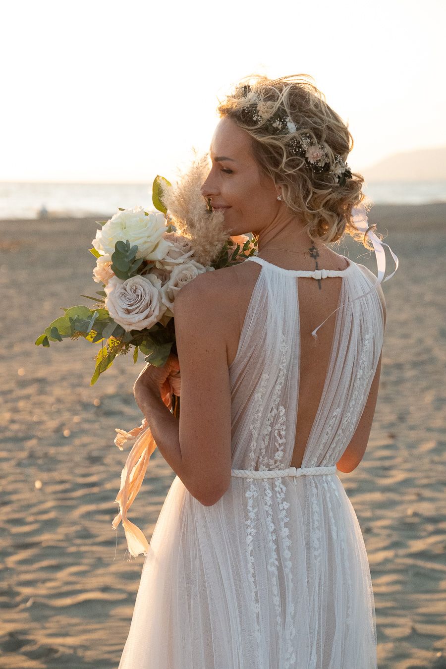 Wedding portrait on a Tuscan beach at sunset