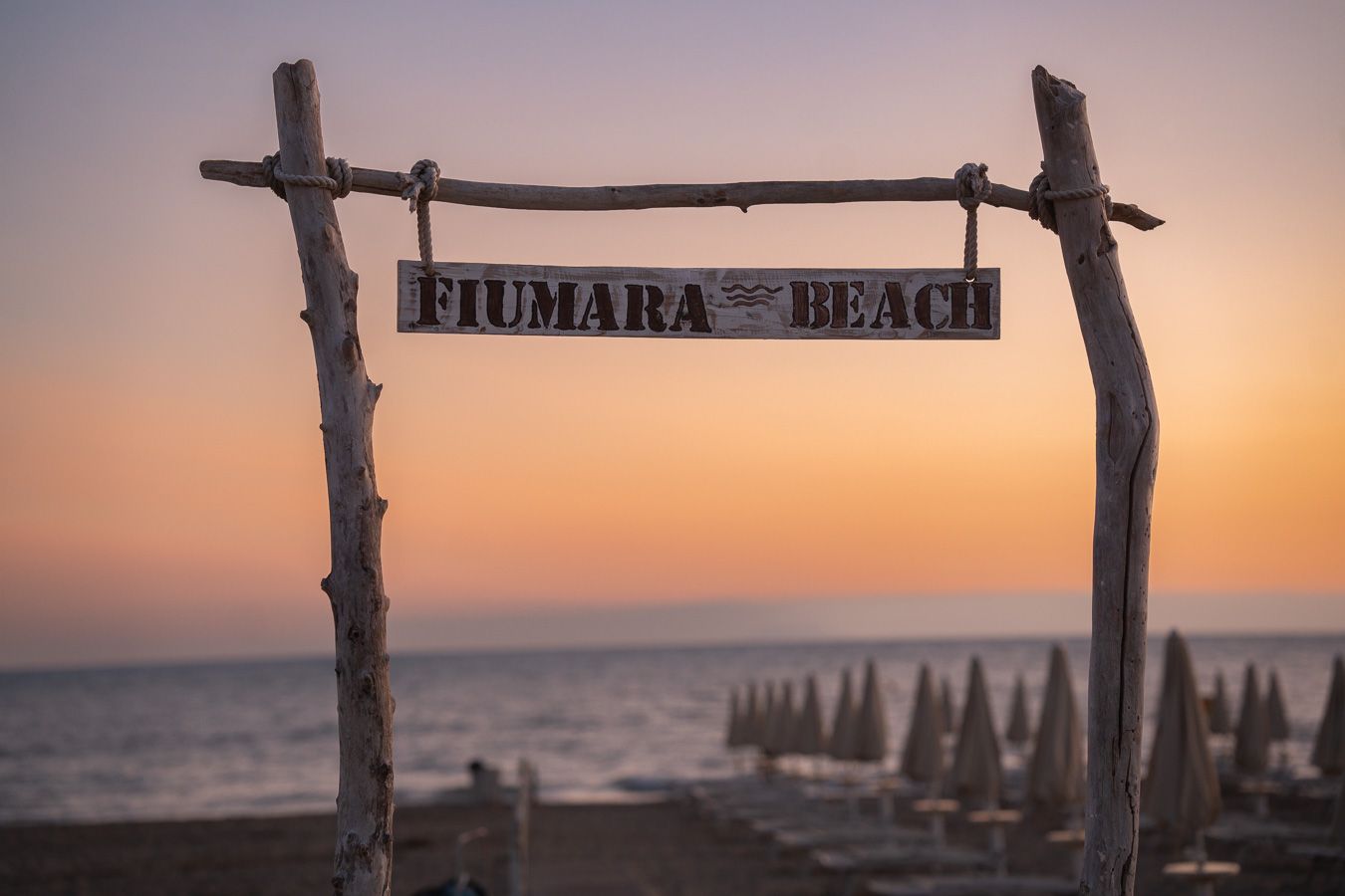 Beach wedding venue at sunset on the Tuscan coast, Italy
