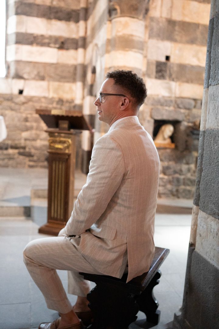 Wedding guest seated inside the historic church