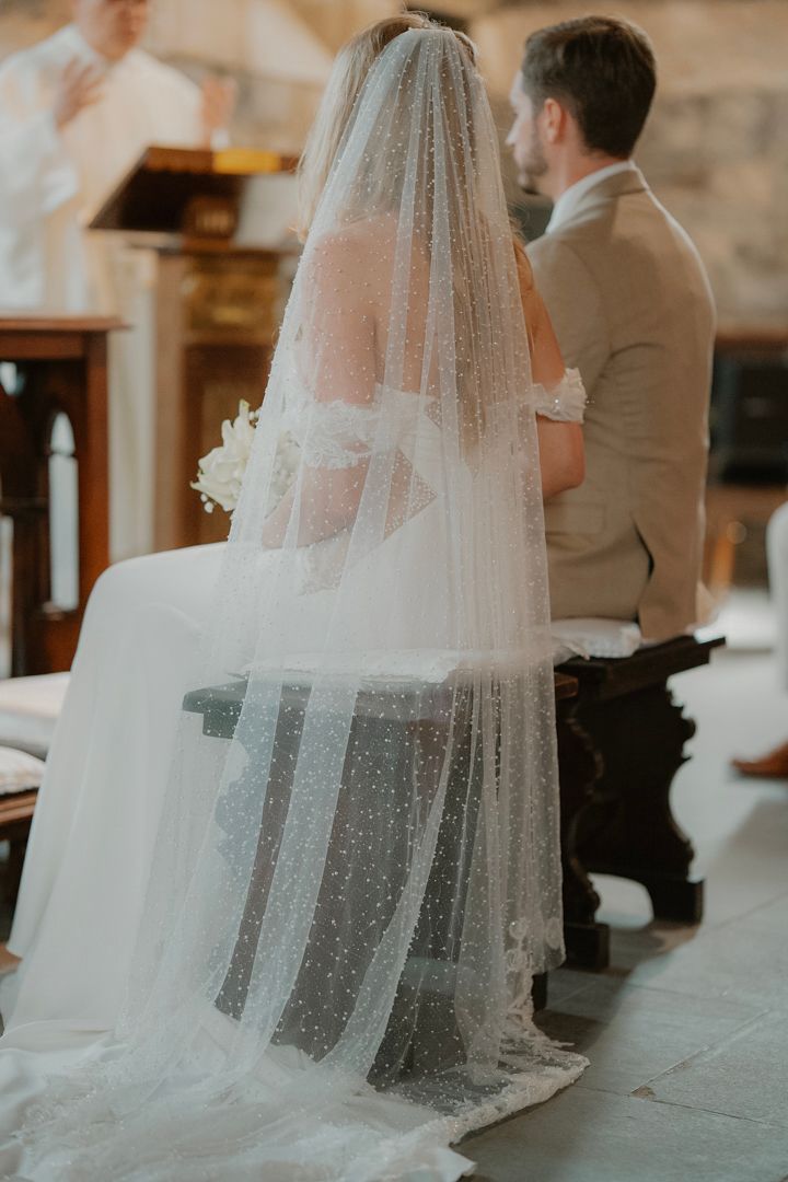 Wedding couple at the altar inside a historic church
