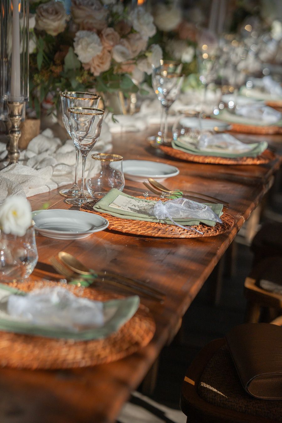 Tuscany wedding reception table with flowers and elegant tableware
