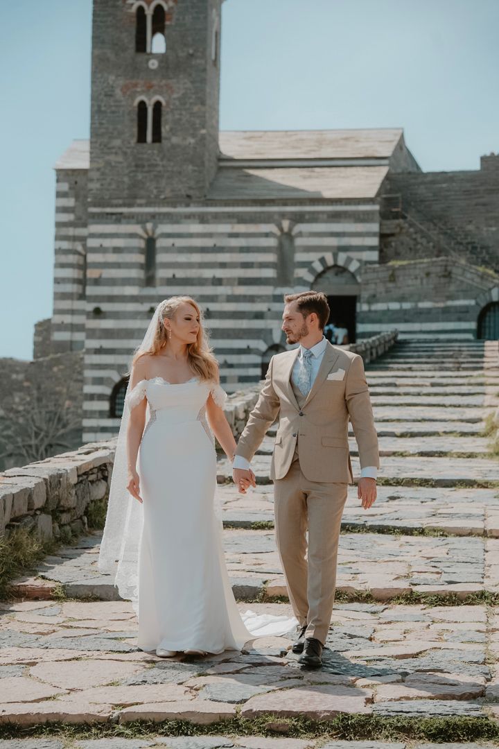 Wedding couple walking through a historic Ligurian village