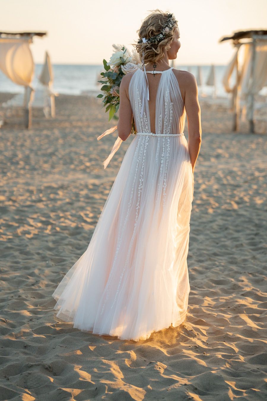 Wedding portrait on a sandy beach in Tuscany