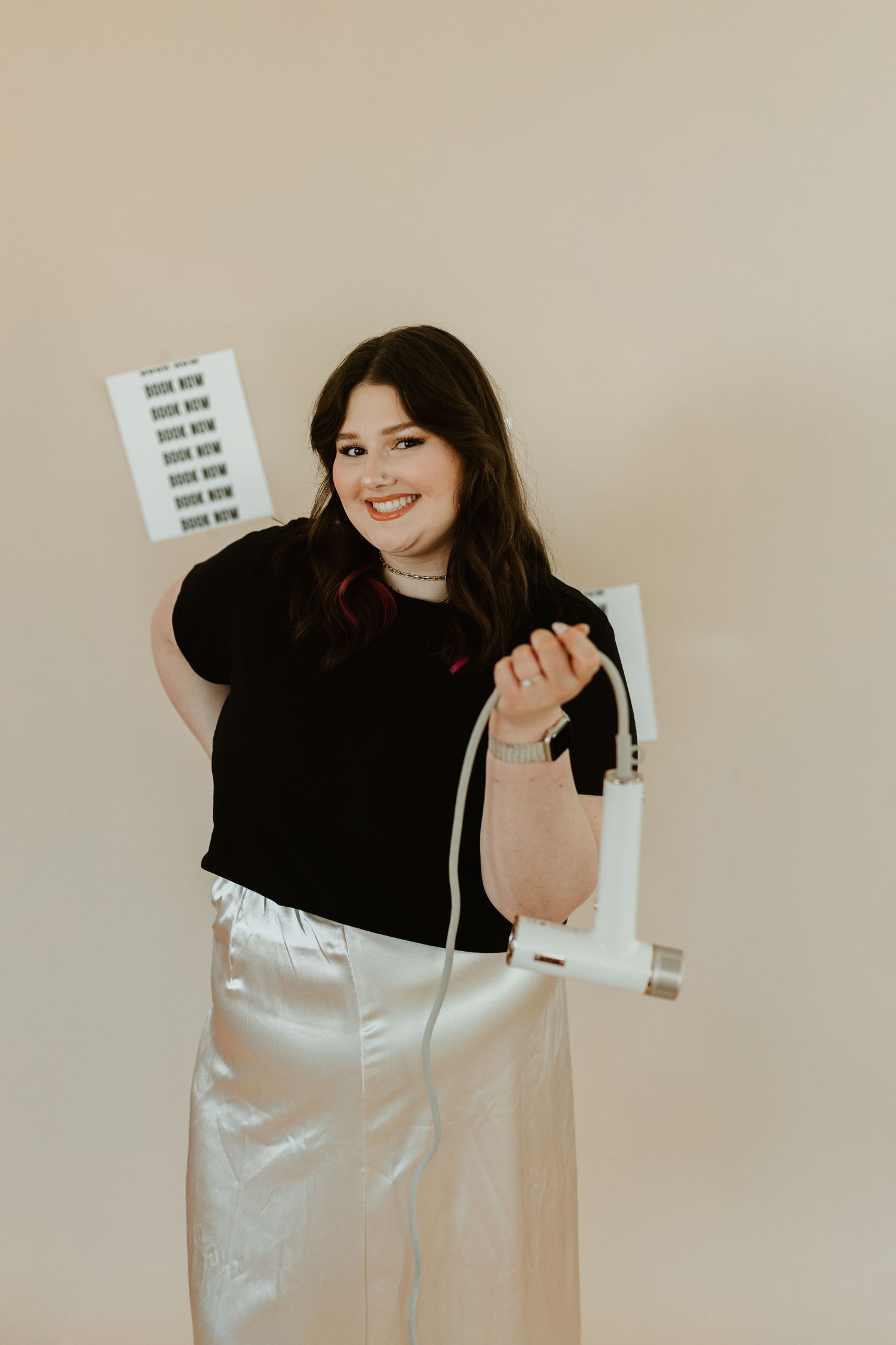 Spartanburg Branding Photographer and content creation for small business owners and others. Stylist standing in front of tan backdrop