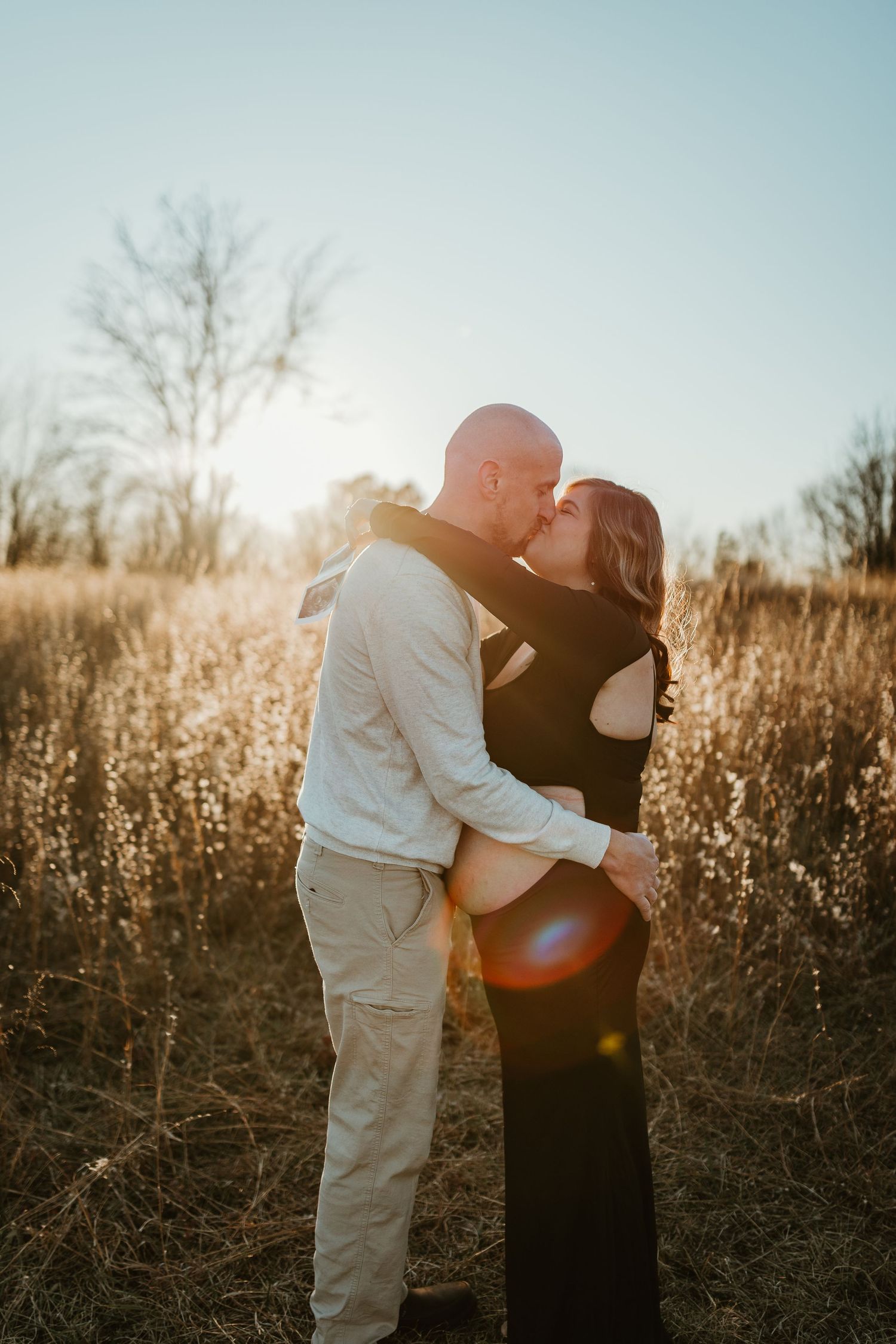 Documentary family photo session in field all hugging close