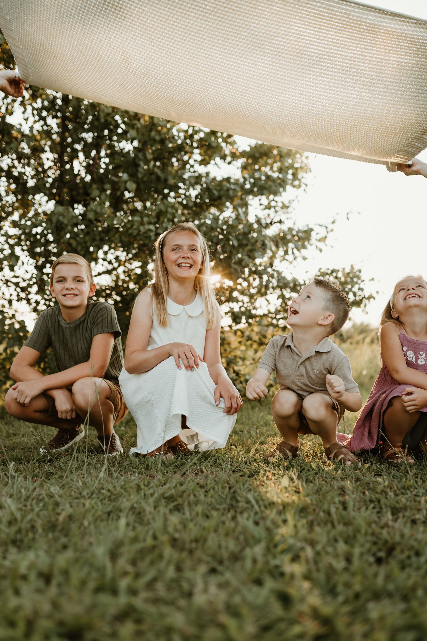 Documentary family photo session in field all hugging close