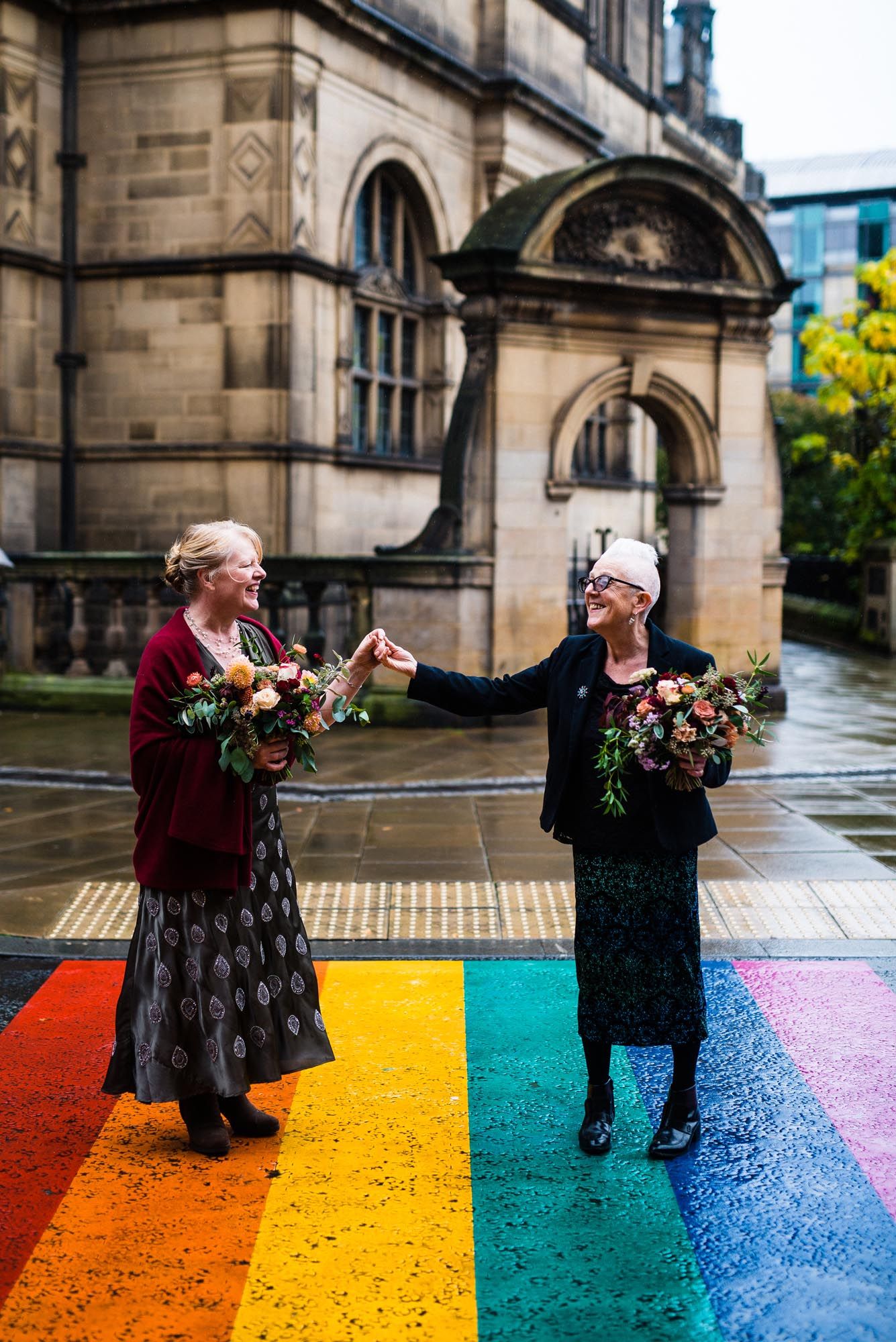 Nottingham wedding photographer capturing two people dance together on colorful painted crossing