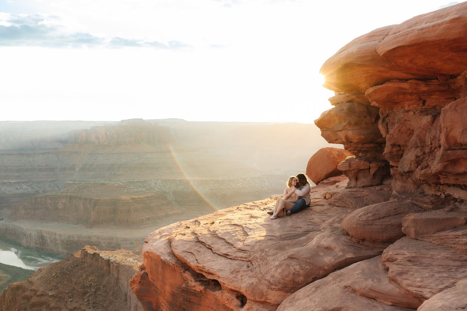 Dramatic desert landscape with red rock formations at sunset.