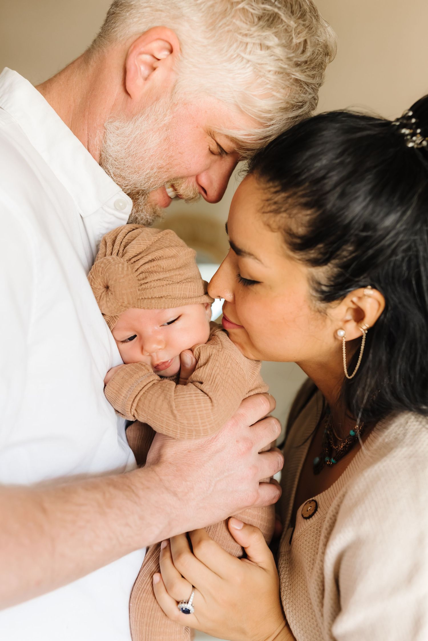 Intimate couple embracing and sharing affectionate moments in a series of romantic photos.
