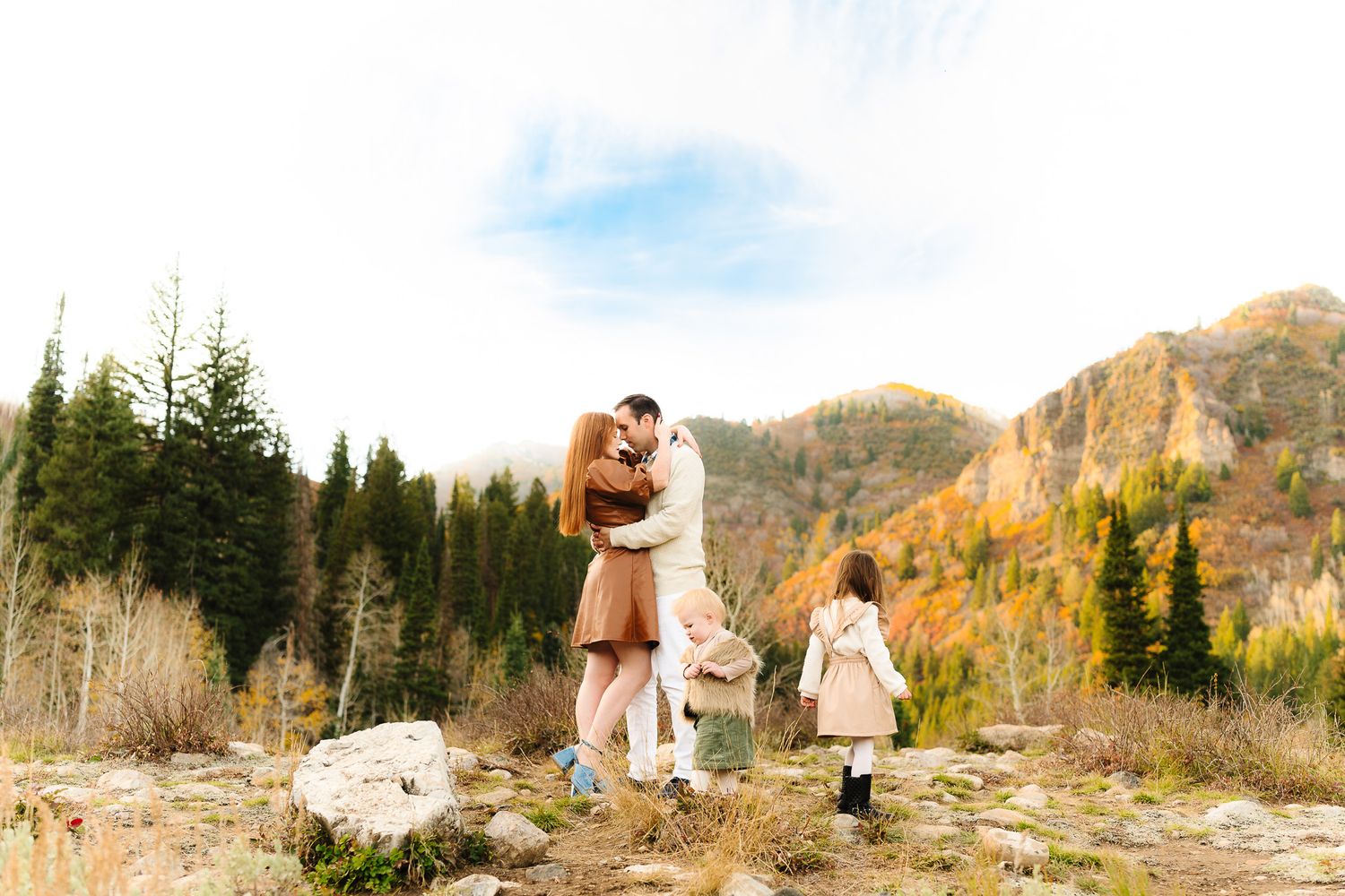 Romantic mountain photography session with fall foliage in the background.