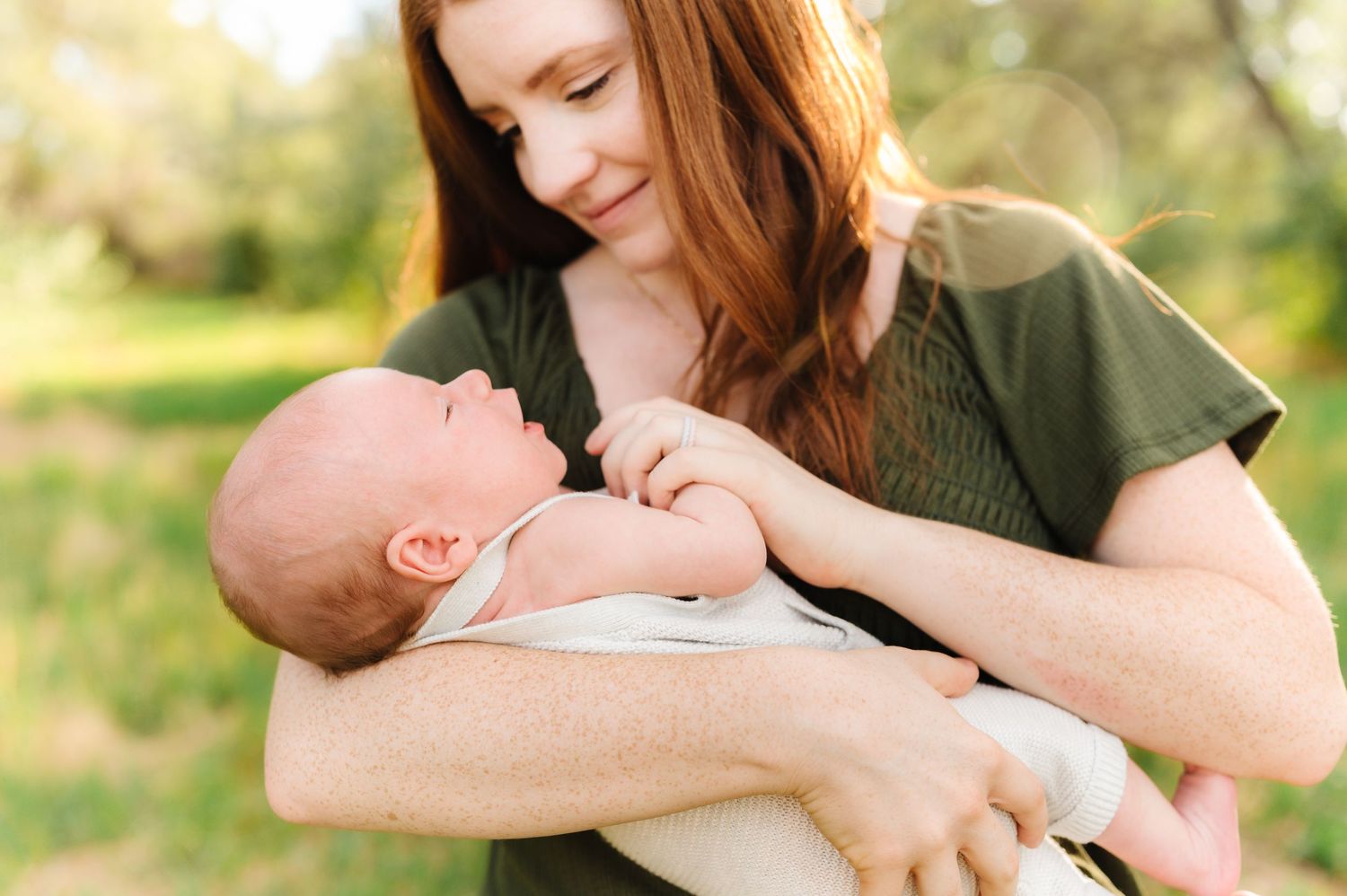 Candid family moments captured during golden hour in a natural outdoor setting.