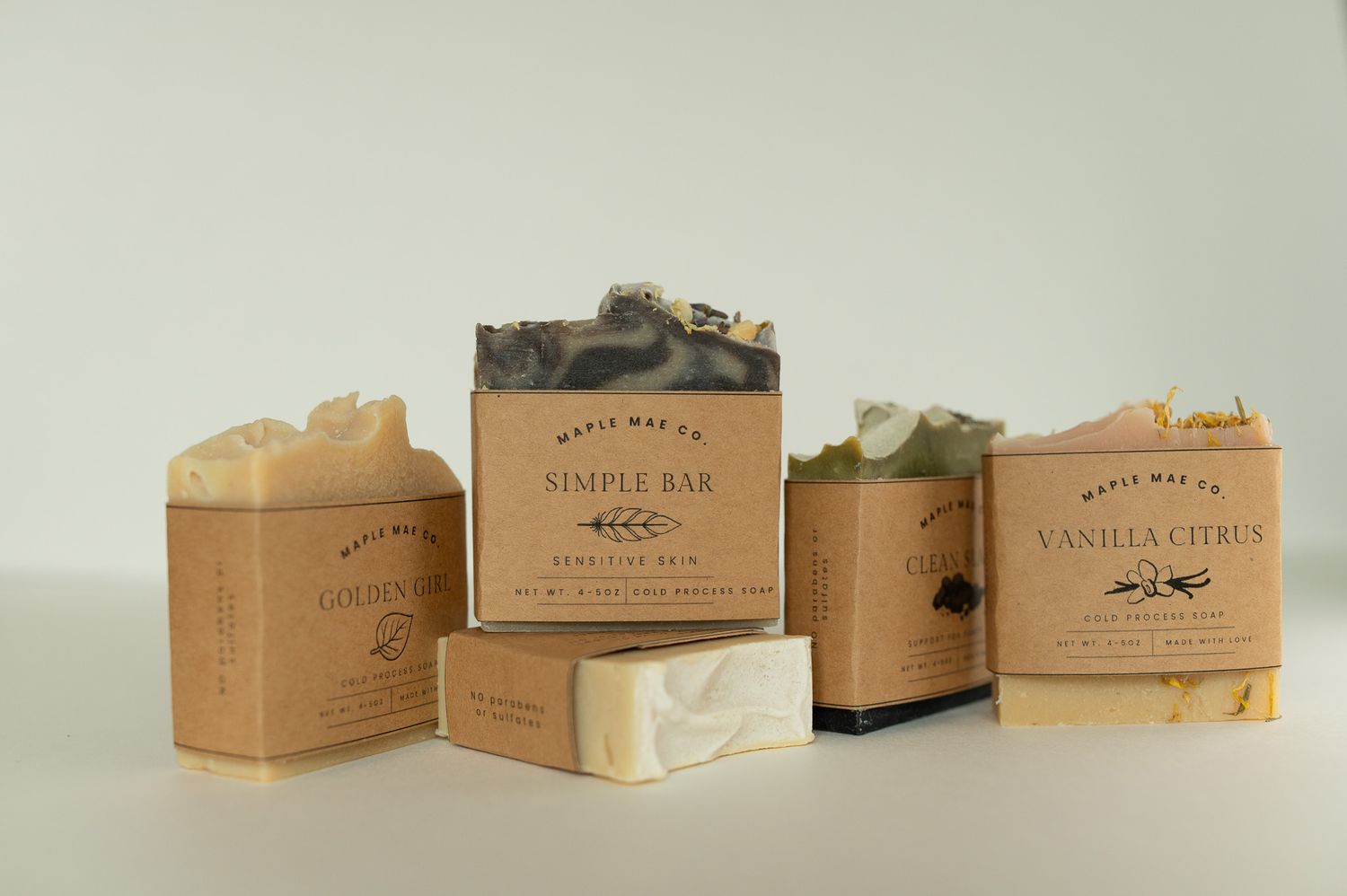 Maple Way Co artisan soap bars including Simple Bar and Vanilla Citrus varieties on display.