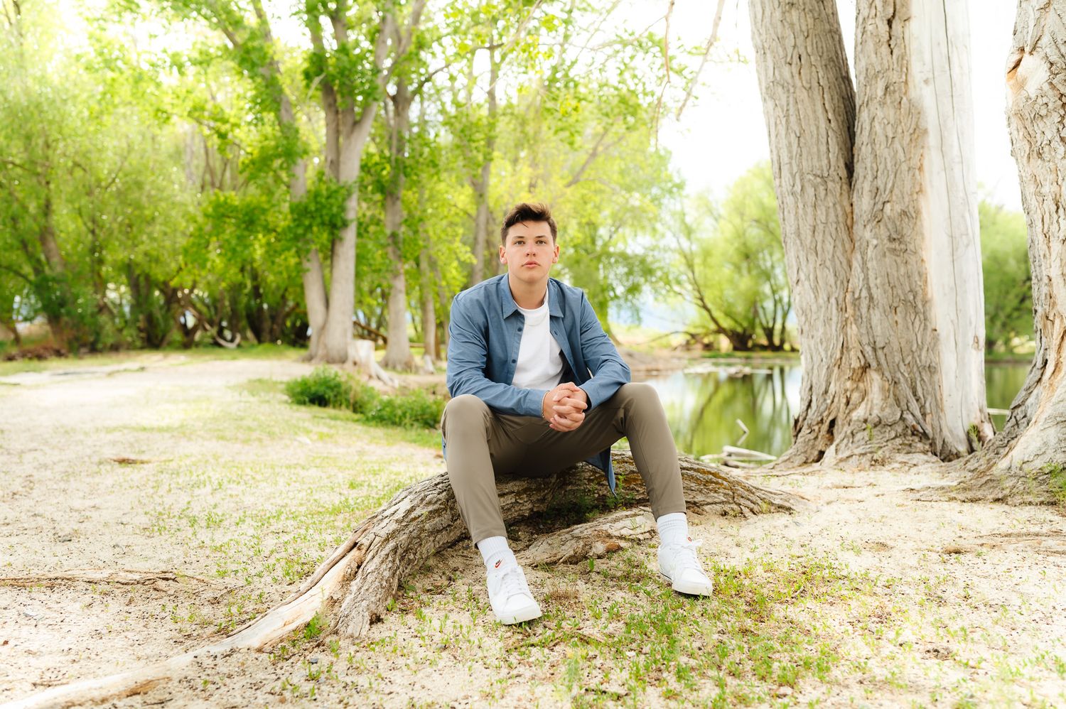 Series of casual portraits taken against tree trunks in a wooded setting.