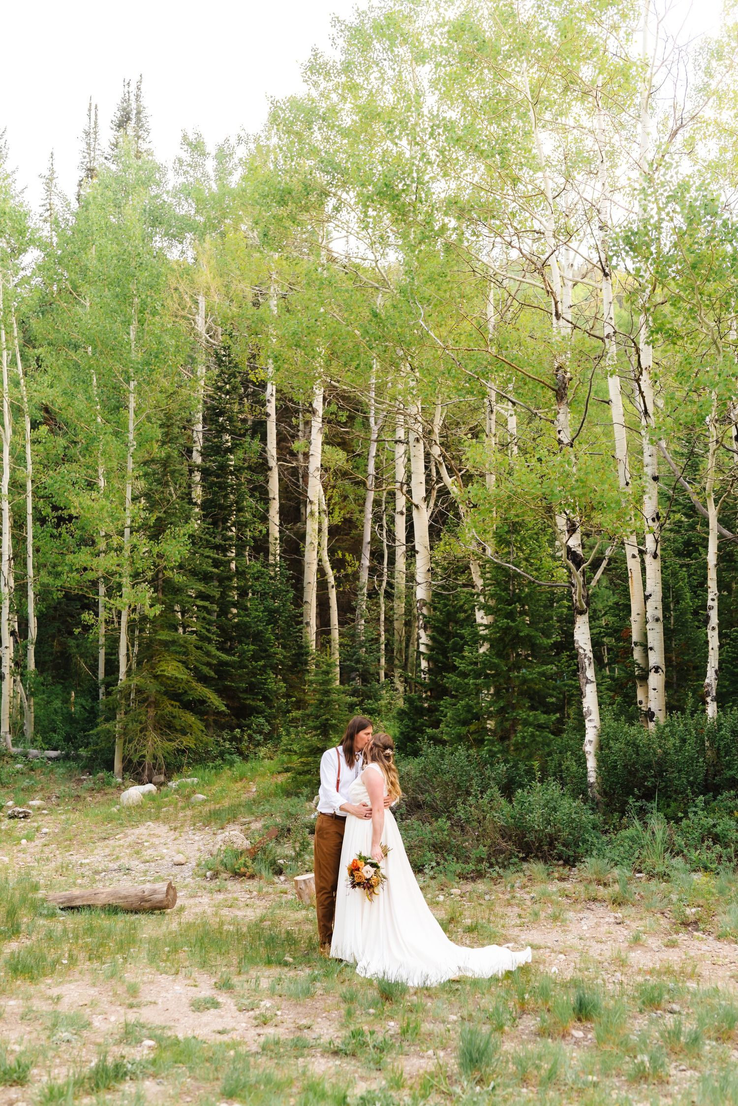 Aspen grove provides natural backdrop for outdoor wedding photography.