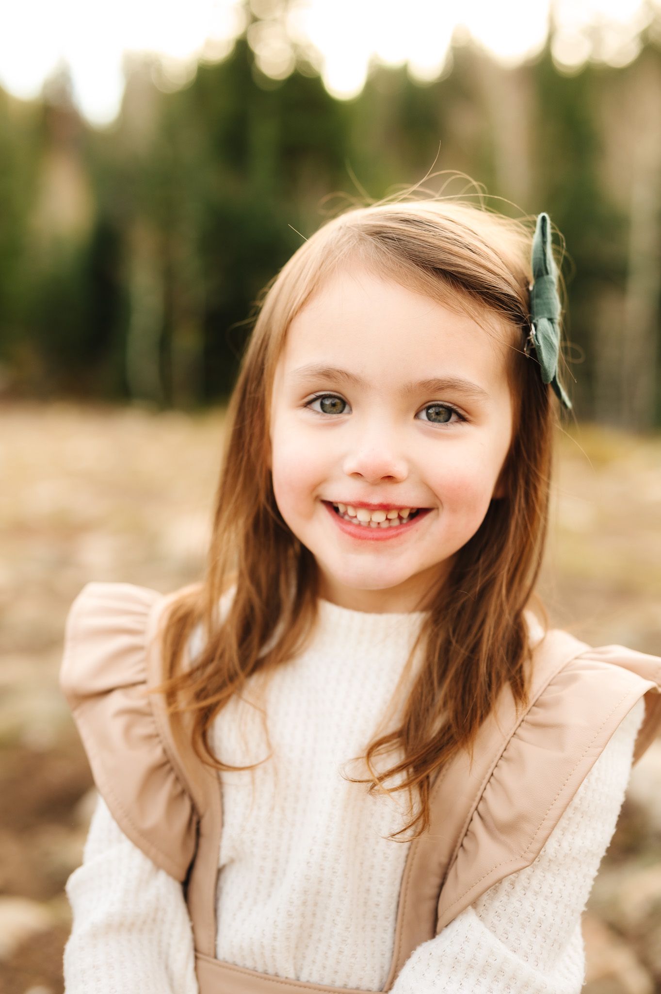 Close-up portrait series showing joyful expressions against a soft natural background.
