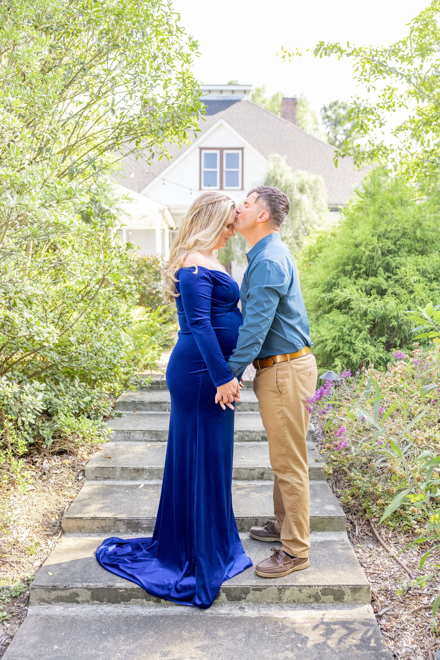 Expecting couple shares a quiet moment on the steps at the Columbus Botanical Garden during their Columbus, GA maternity portrait session.