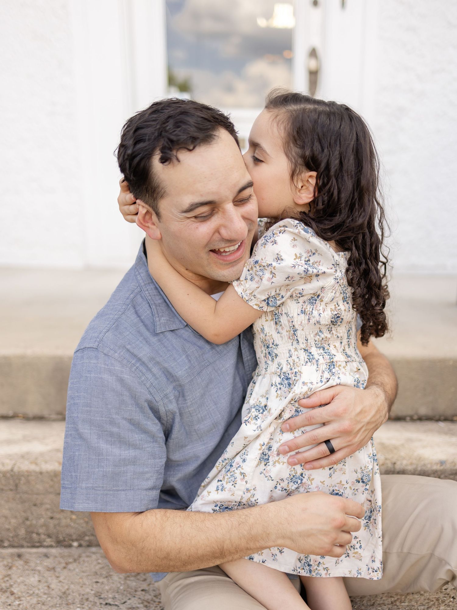 Sweet moment of affection between a dad and his daughter captured by an Auburn family photographer.