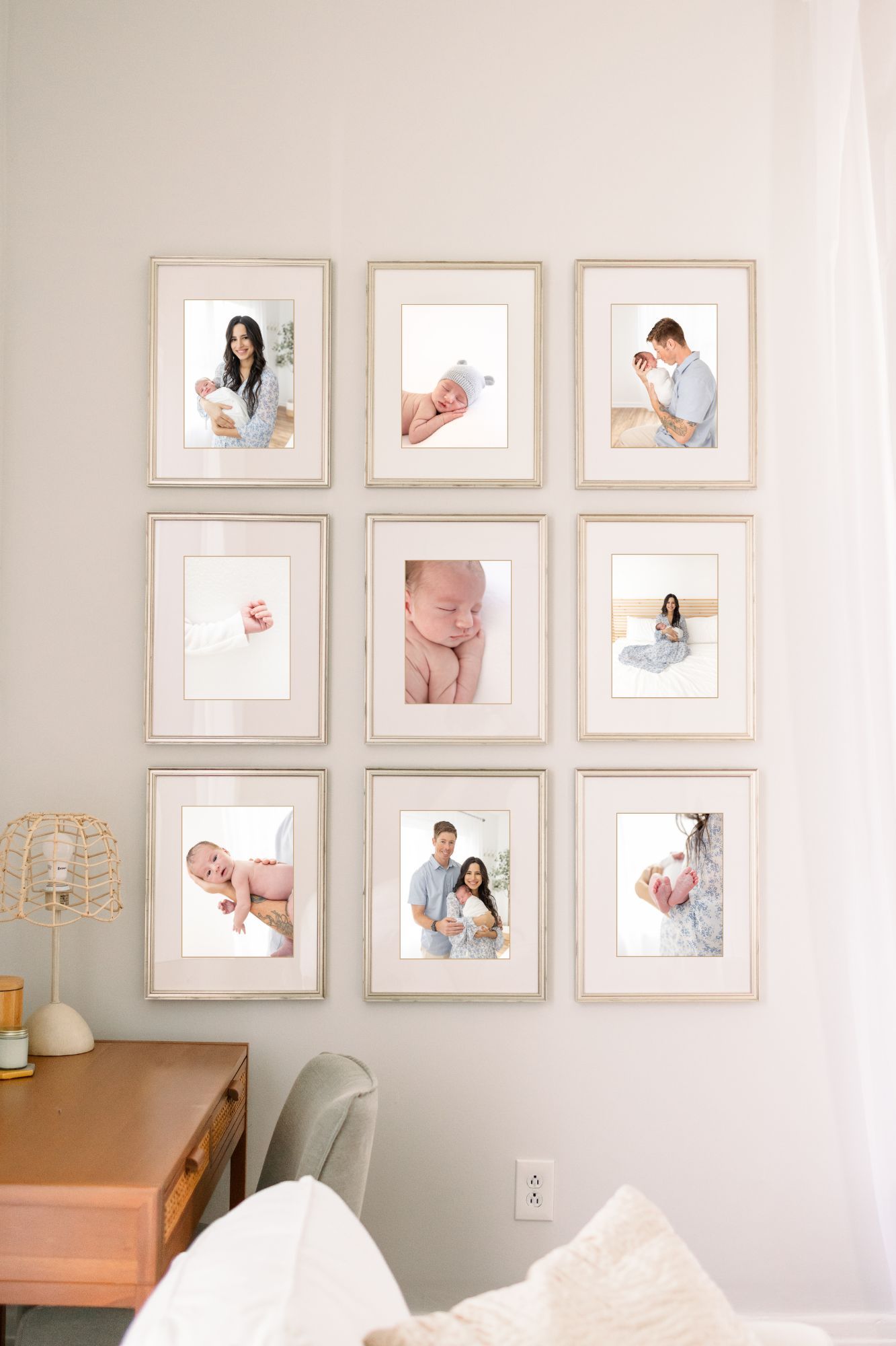 Gallery wall of 9 framed newborn portraits by Columbus, GA photographer Carolina Bowers Photography.