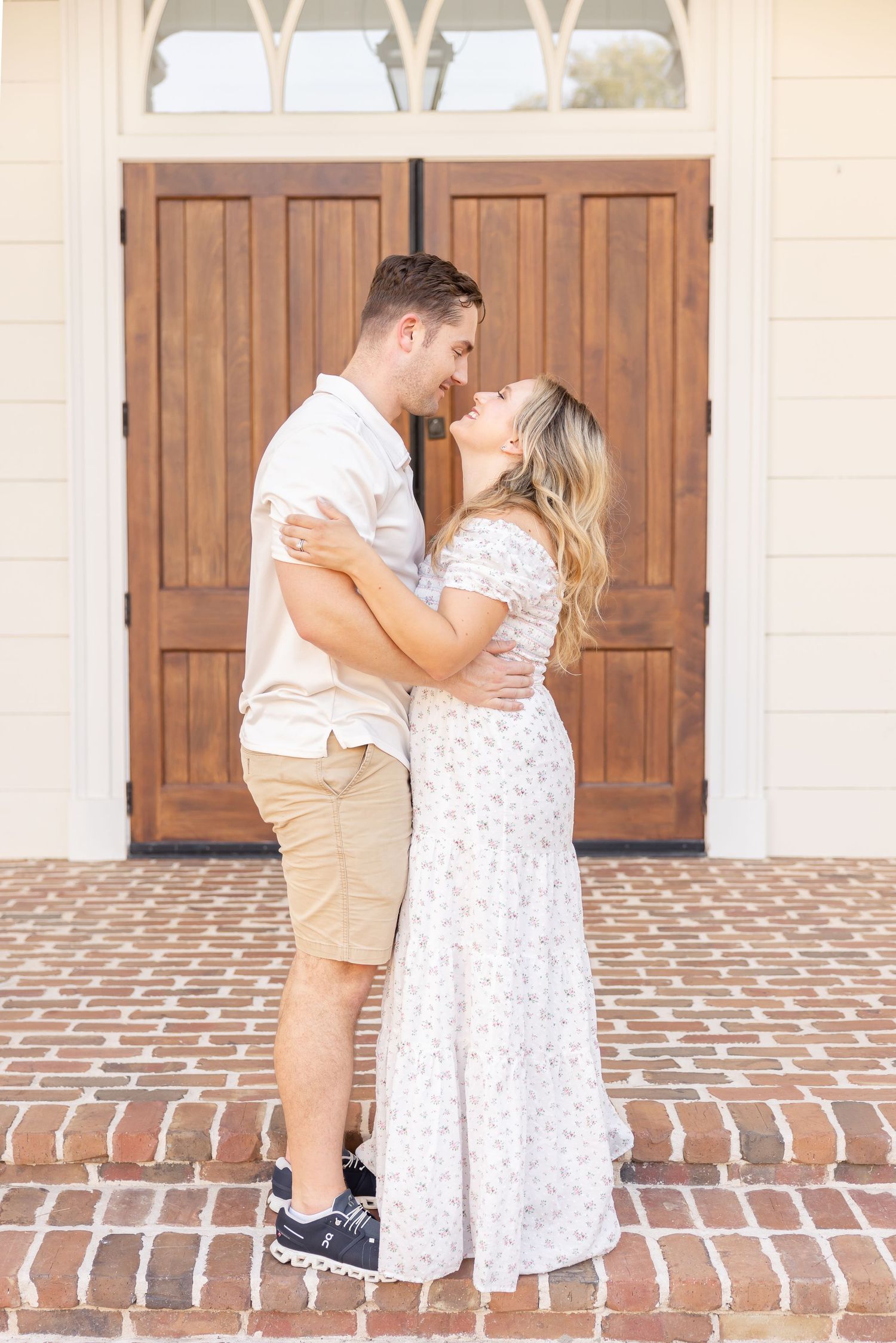 Parents sharing a quiet moment on brick steps during their family summer portraits in Columbus, GA.