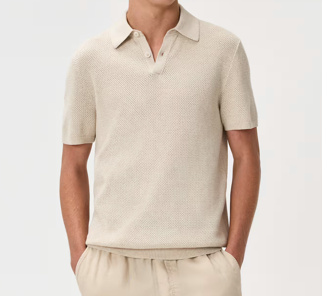 Men's beige knit polo shirt with short sleeves, open collar, and textured fabric, paired with matching trousers.