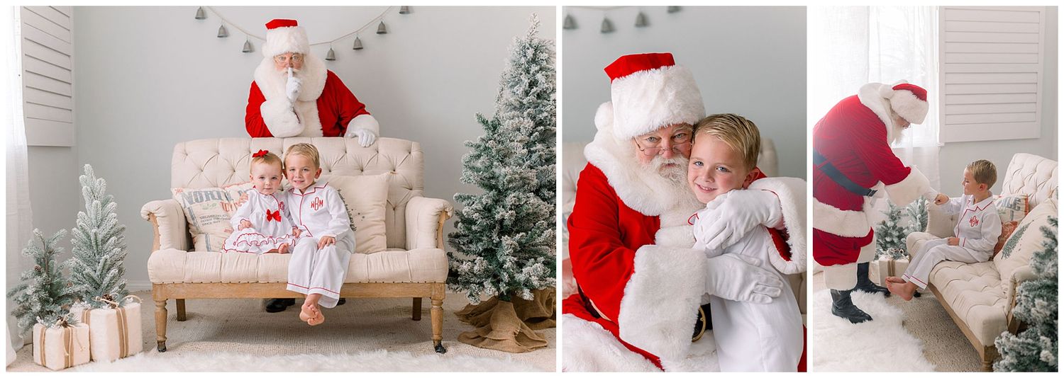 Toddler in pajamas sits on vintage settee with Santa by Christmas trees in bright white studio.