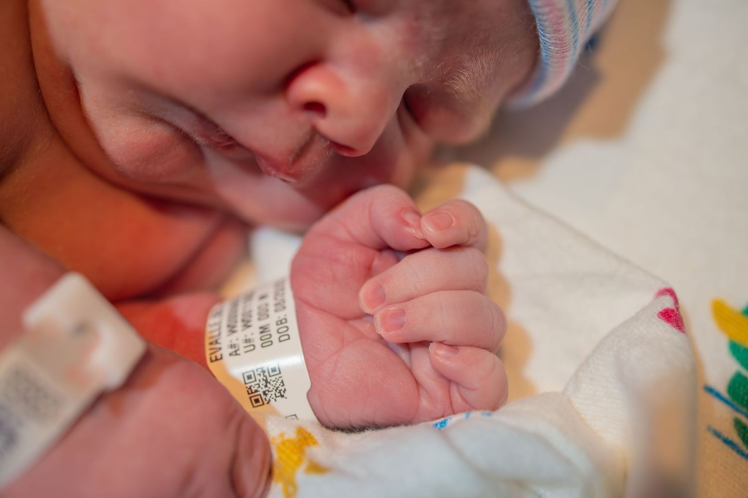 Close-up shots of a newborn baby's tiny features and details.