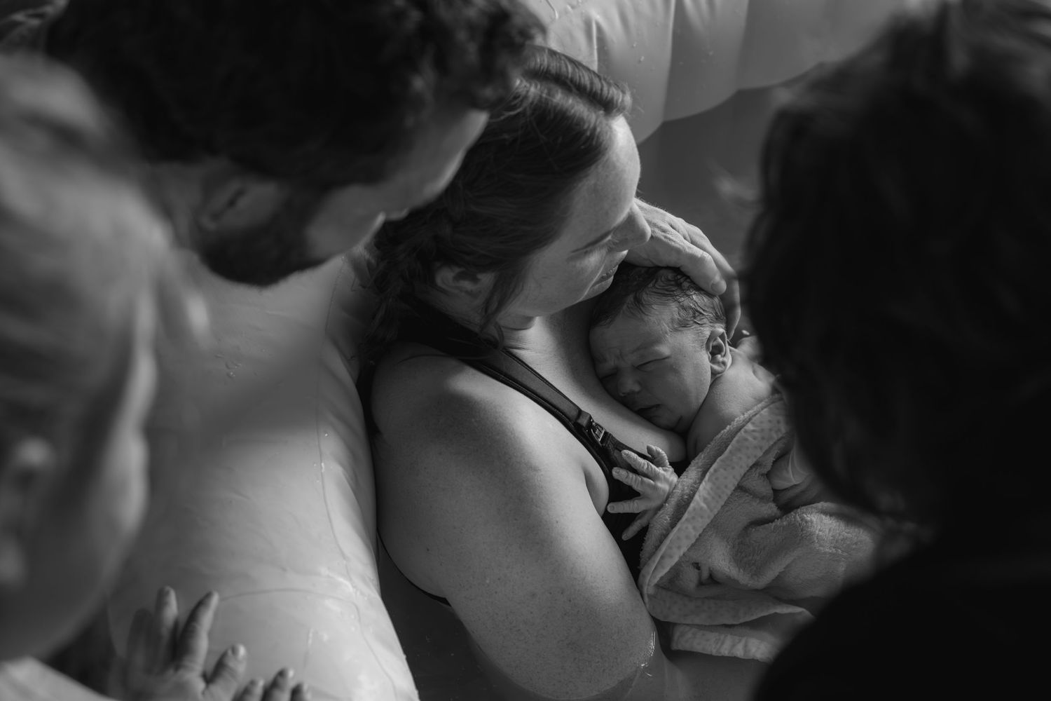 Black and white photographs capturing emotional moments in a medical setting.
