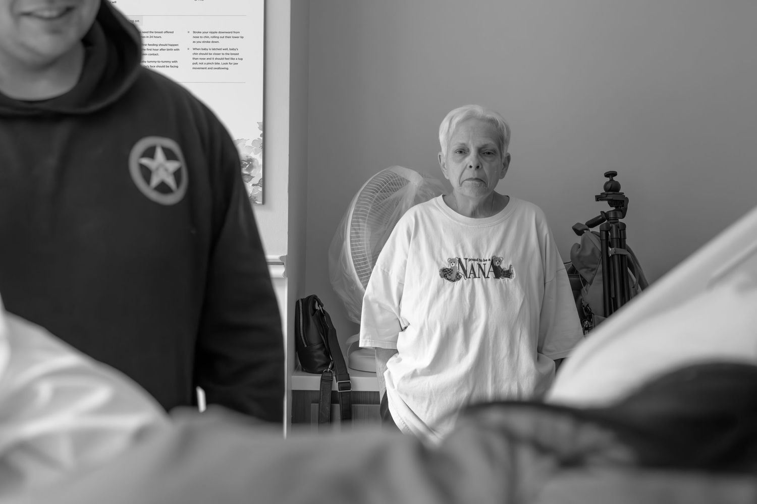 Medical professionals gathered in a hospital room during a procedure.