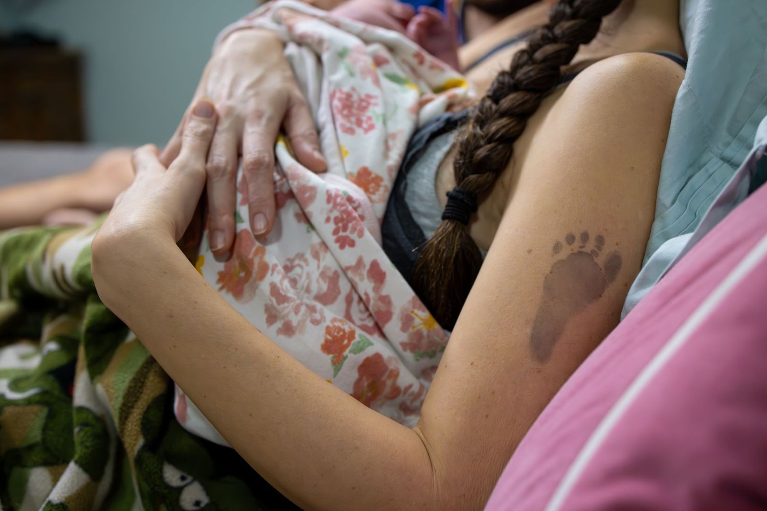 A small footprint temporary tattoo visible on someone's arm.
