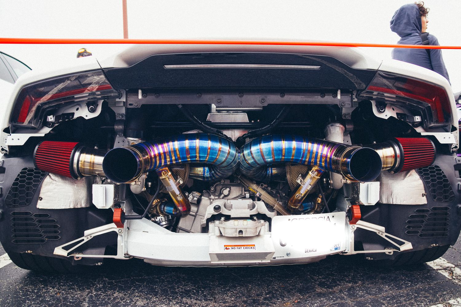 Close-up of custom titanium exhaust system with blue heat discoloration.
