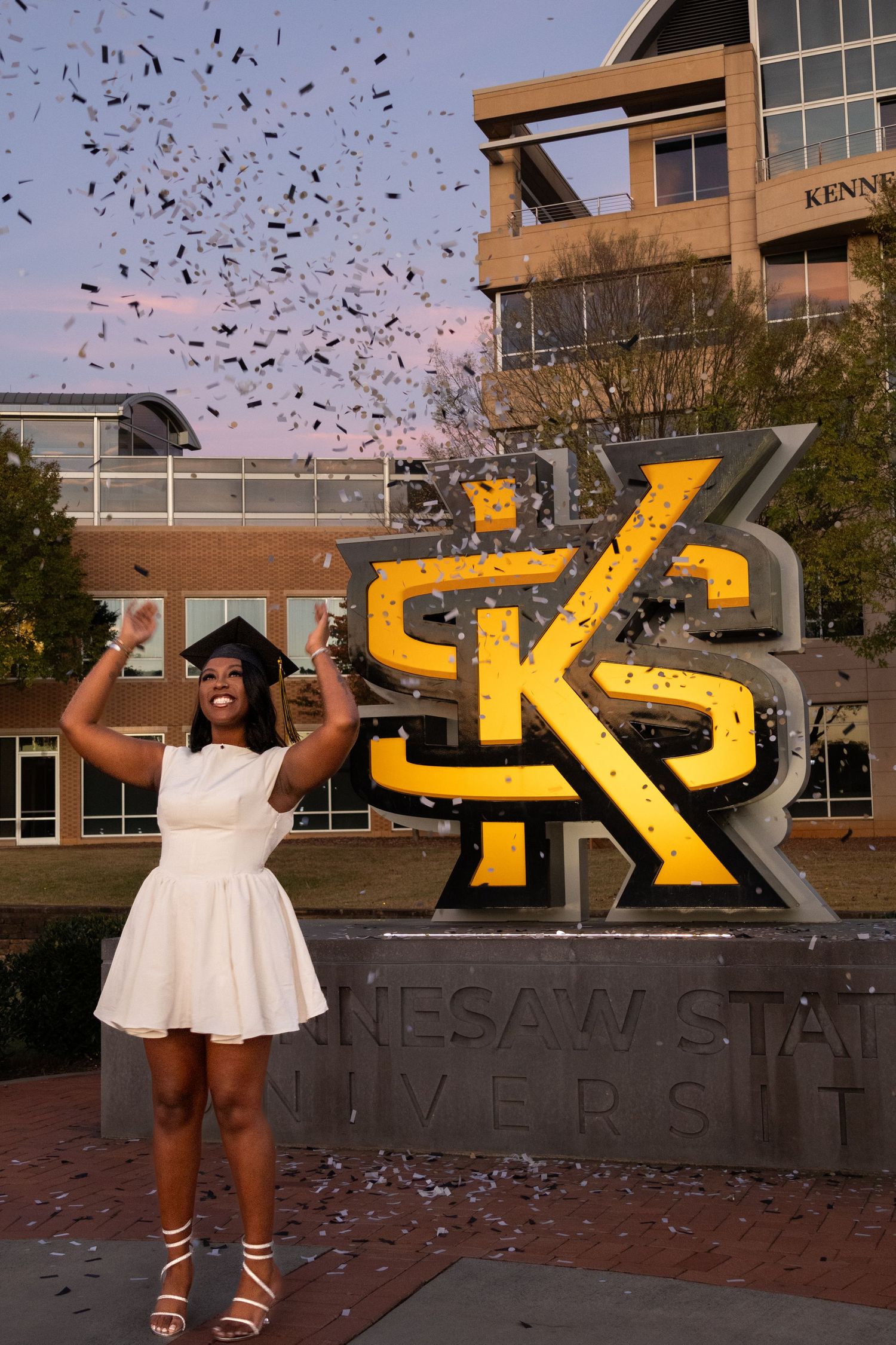 Celebration scene with confetti at Kennesaw State University's iconic KS logo monument.