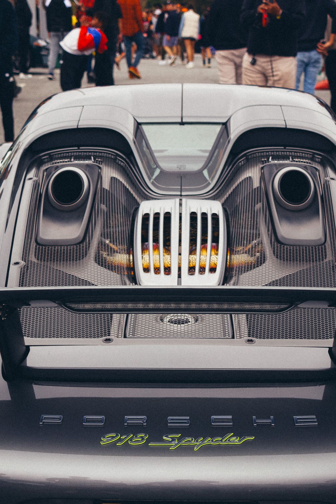 Close up of exotic car's dual exhaust system and carbon fiber rear diffuser.