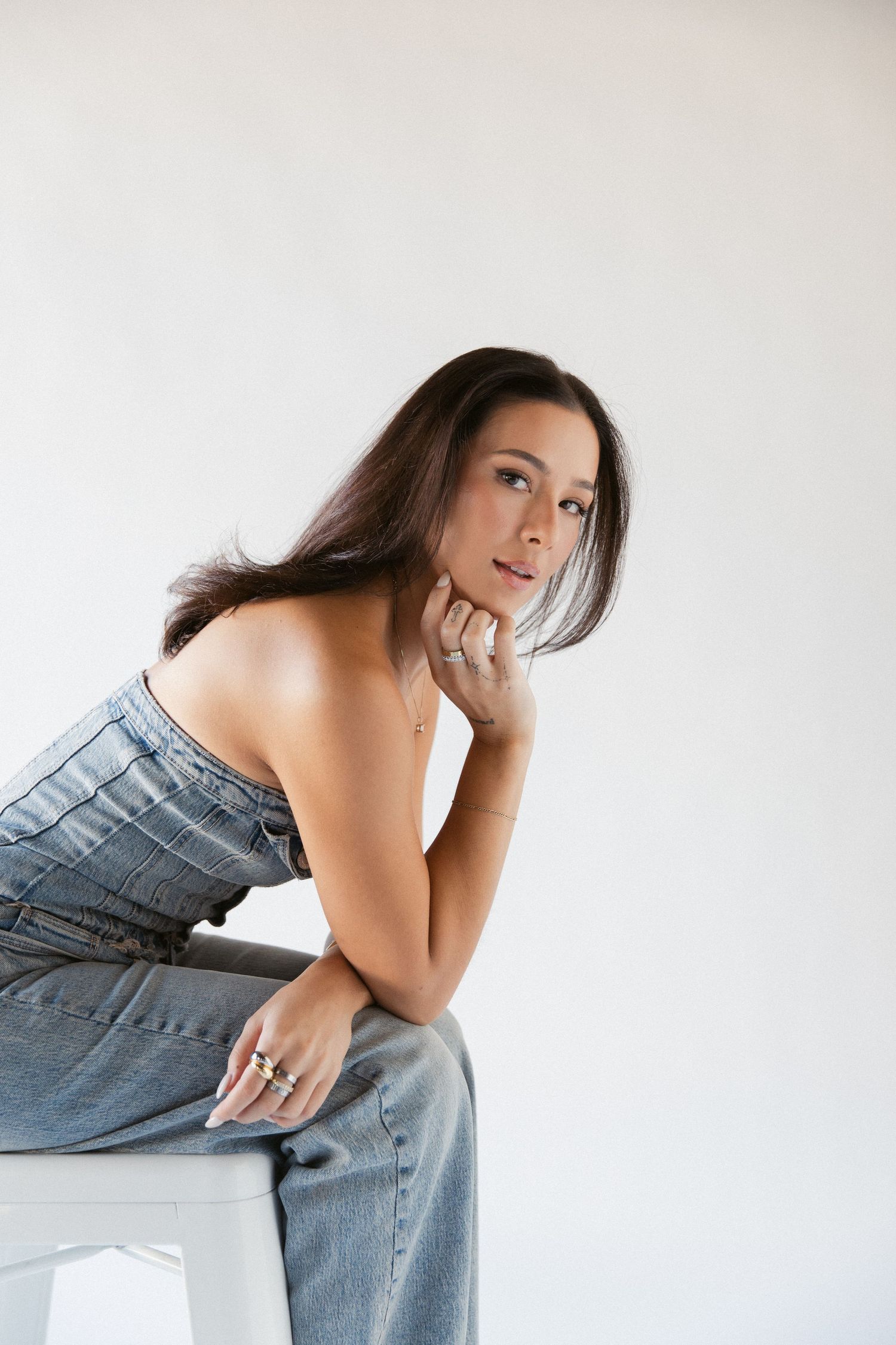 Stylish fashion photography of casual denim wear against a white backdrop.