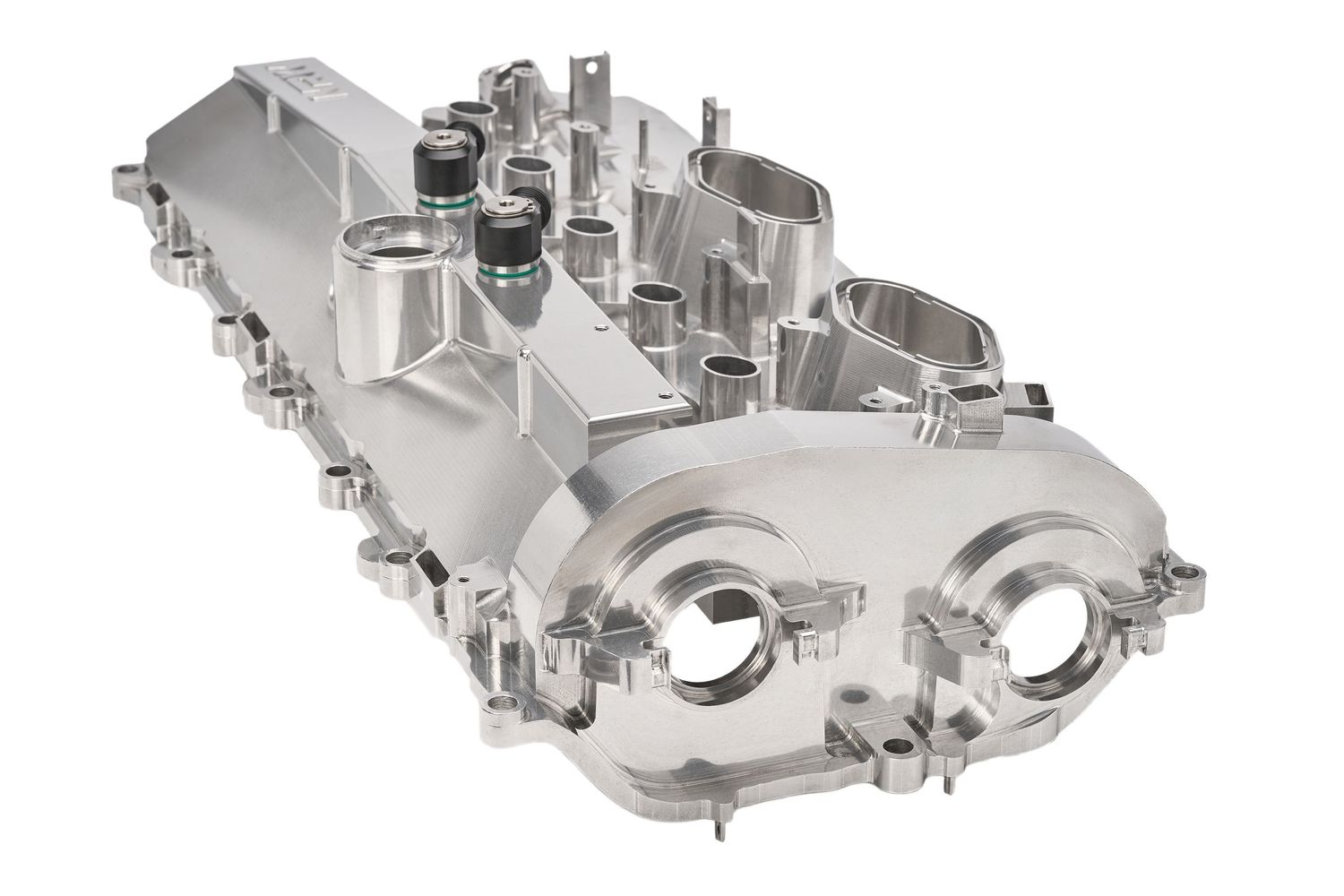 Polished silver aluminum overhead valve cover assembly with mounting bolts and dual port openings.