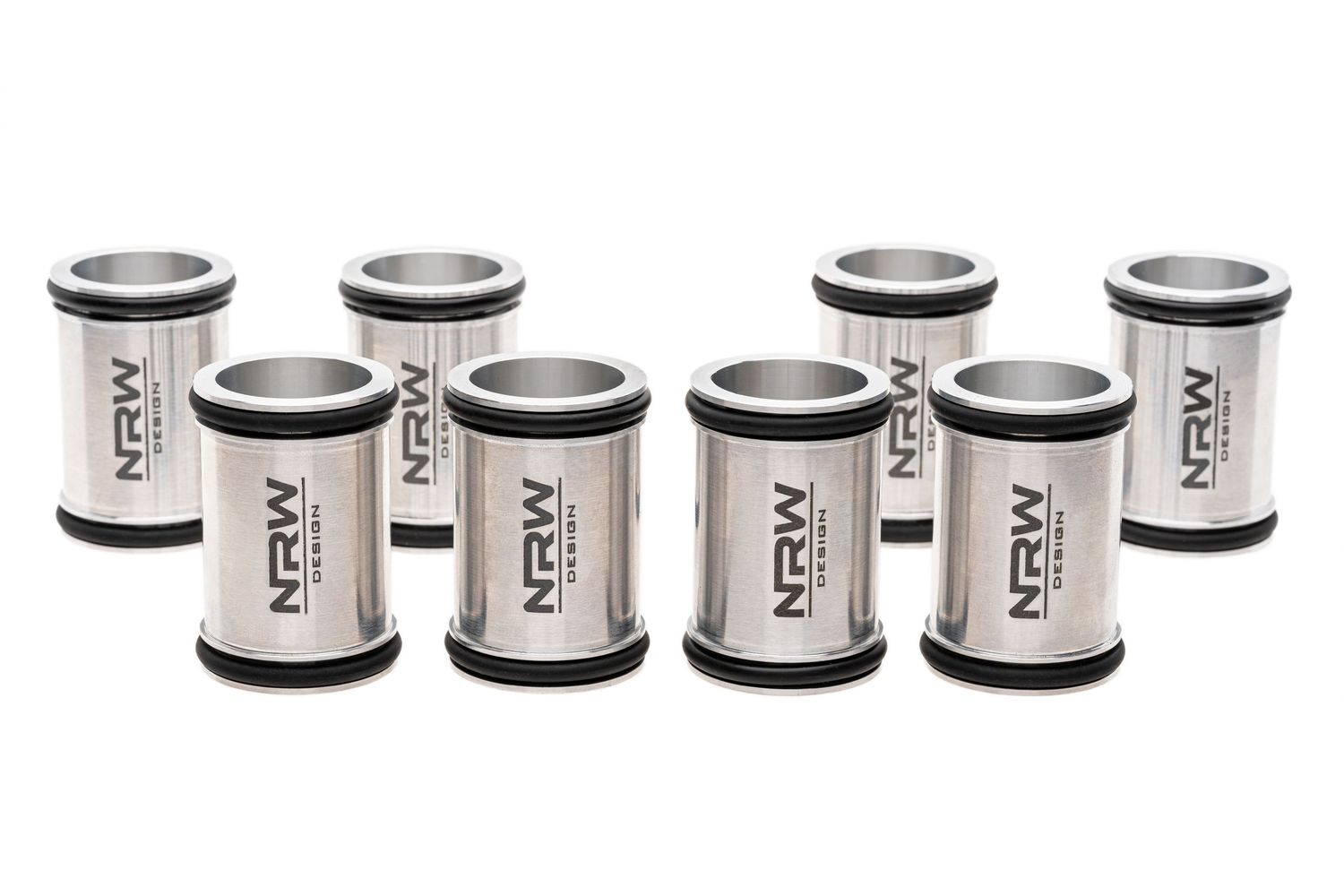 Collection of eight metallic NREW cylindrical water filters with black end caps arranged in neat rows.