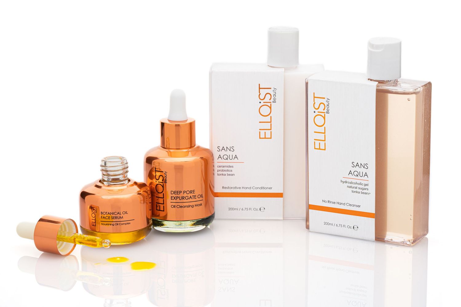 Collection of luxury skincare products including serums and boxes from Ellust brand arranged on white background.