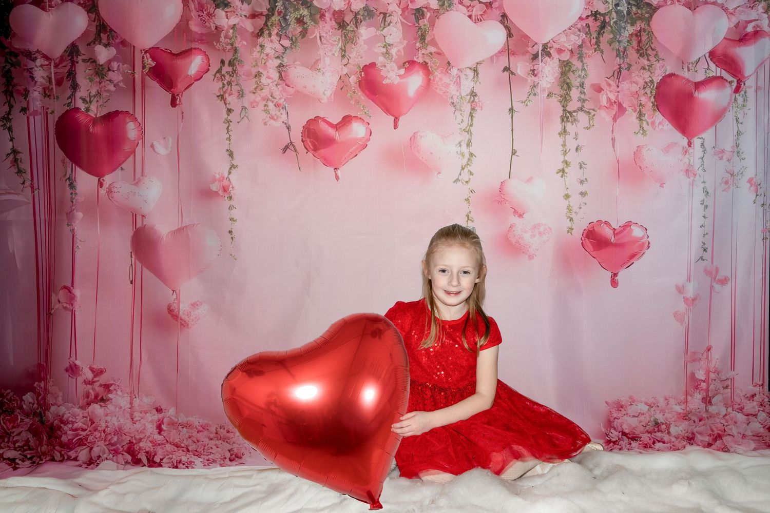 Romantic pink and red heart balloons create a dreamy Valentine's Day backdrop with glittering decorations.
