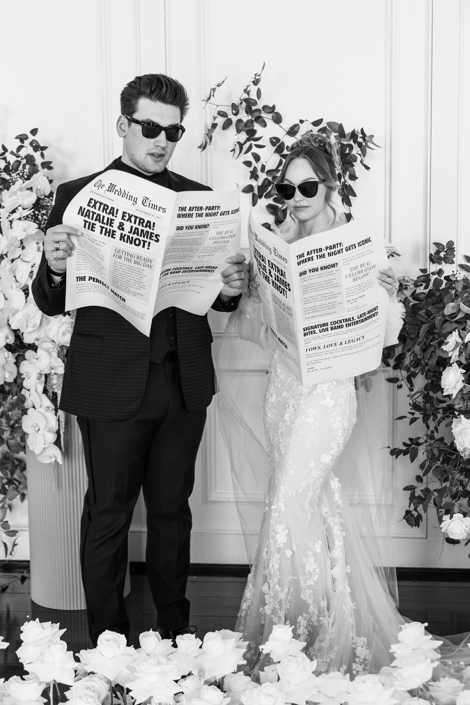 Humorous black and white photo of wedding couple reading newspapers while wearing sunglasses.